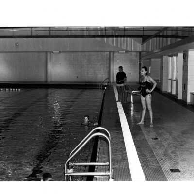 Women swimming in pool in Sports Complex.