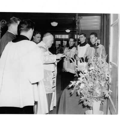 Interior view of Field House (Sports Complex) dedication with Dennis Cardinal Dougherty, Msgr. Francis Furey, John J. Long, S.J., William J. Byron, S.J. (class 1951), Bernard Lanin