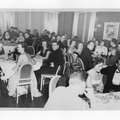 View of young alumni association members and their guests attending formal dinner, c. 1949.