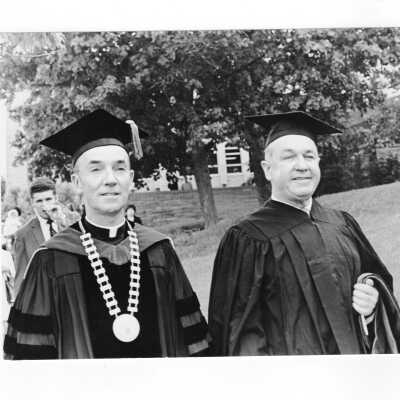 Terrence Toland, S.J., processing with honorary degree recipient, Governor William T. Cahill during 1970 graduation/commencement.