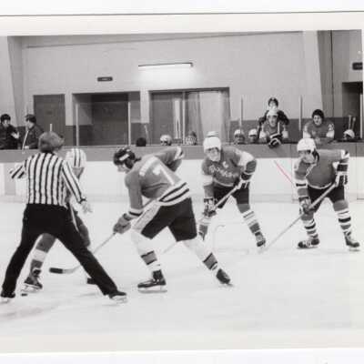 Men's ice hockey team in game.