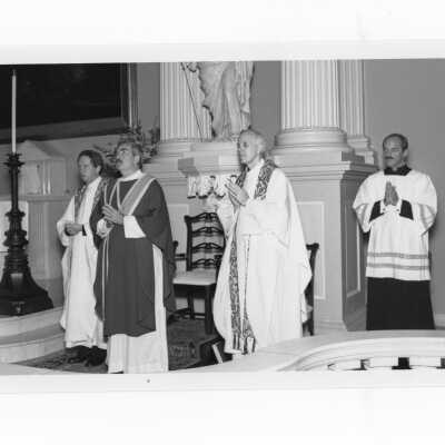 Inauguration of President Nicholas S. Rashford, S.J., October 4, 1986. Father Rashford is saying Mass in Old Saint Joseph's Church, Willings' Alley, Philadelphia, with concelebrants, Father Devereux, S.J. and Father Watters, S.J.