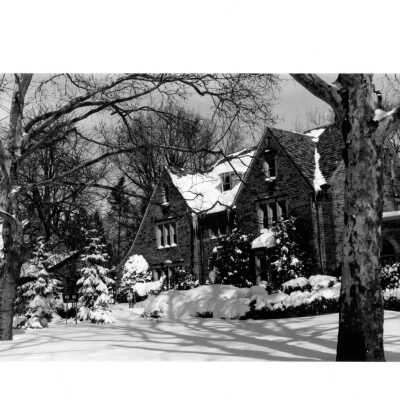 View of front of Regis Hall in snow.
