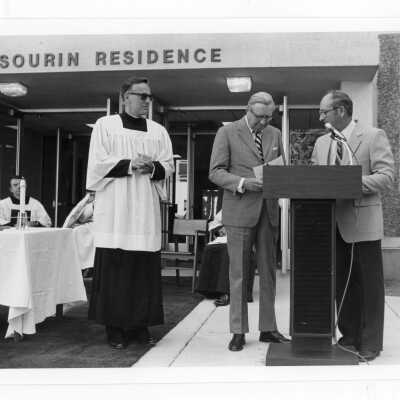 Donald I. MacLean, S.J., and others at dedication of Sourin Residence Center.
