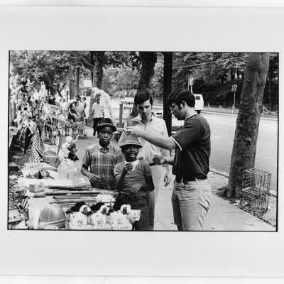 Students from "The House" or SJC Commune at 17th and Girard Streets, Philadelphia, with neighborhood children at street fair.