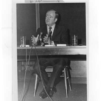 Vice President Hubert Humphrey seated at table speaking during his visit to SJC campus, January 27, 1970.