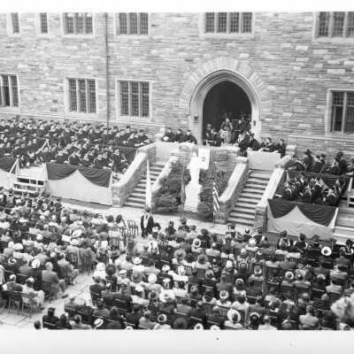 Views of 1948 graduation/commencement ceremony in Barbelin quadrangle. There are four black and white prints, one with John J. Long, S.J. and others.