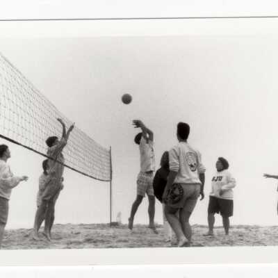 Students playing beach volleyball.