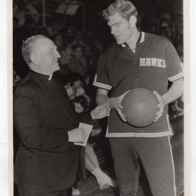 Men's Basketball player John Connolly with Emory Ross, S.J.