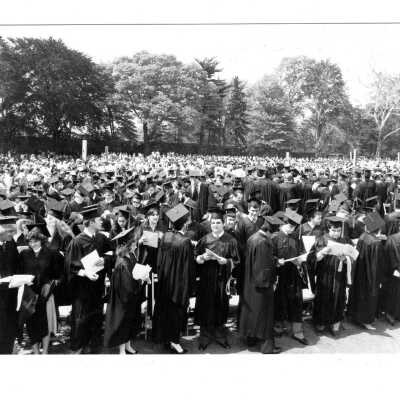 View of graduating students and guests in audience during graduation/commencement, c. 1984.