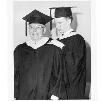 Two graduates, Alfred Baker and Thomas F. Finnegan, during 1966 graduation/commencement.