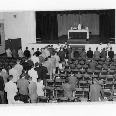 Students attending mass in Flanigan Auditorium.