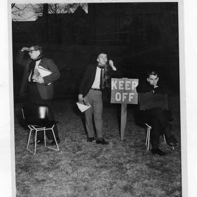 Student prank with John Lehman, Frank Hargedon, and Dick Corliss around Keep Off sign.