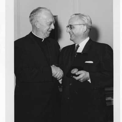 J. Joseph Bluett, S.J., congratulates Shaffrey award winner, Dr. William A. Sodeman, April 29, 1962.
