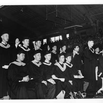 Air Force ROTC graduates being commissioned during 1954 graduation/commencement ceremony in Field House. This was the first class at Saint Joseph's to have Air Force ROTC graduates.