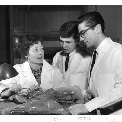 Catherine "Kay" Nash (Biology) working with students in laboratory.