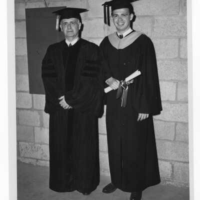 Graduating student Godfrey Schroth, Jr., with his alumnus father, Godfrey Schroth, Sr., at 1949 graduation/commencement ceremony.