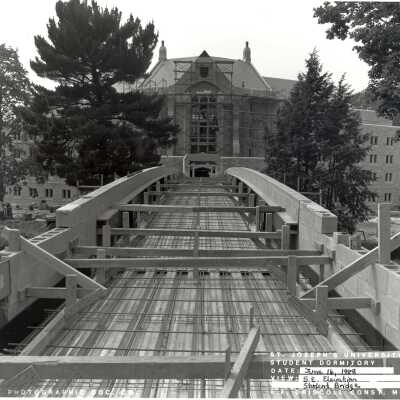 View of pedestrian bridge to McShain Hall under construction.