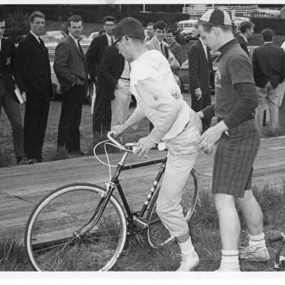 Spectators watching students in bicycle race during Junior Week activities.