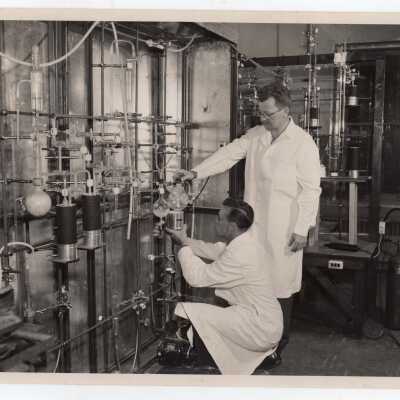 Two chemistry students conducting experiment in science laboratory, July 1955.