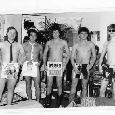 Five male students of Saint Albert's Annex dressed in student residence dormitory room dressed only in ties and album covers.