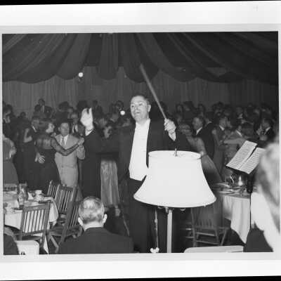 View of conductor during alumni association formal dinner dance, January 31, 1953.