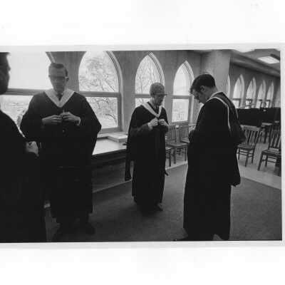 Inauguration of President Terrence Toland, S.J., November 14, 1968. Faculty members robing in Drexel Library before ceremony.