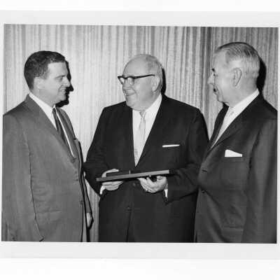 Shaffrey award recipient, Dr. John McCormick, being congratulated by two individuals, April 30, 1970.
