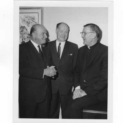 William F. Maloney, S.J., with two members of alumni association, January 18, 1965.