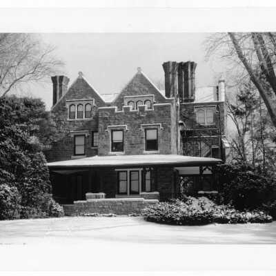 View of west side of Wolfington Center (formerly Gest Estate, Neumann Hall) in snow before exterior renovation and porch rebuilding.
