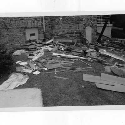 Exterior view of debris on ground outside of Simpson Hall after fire.