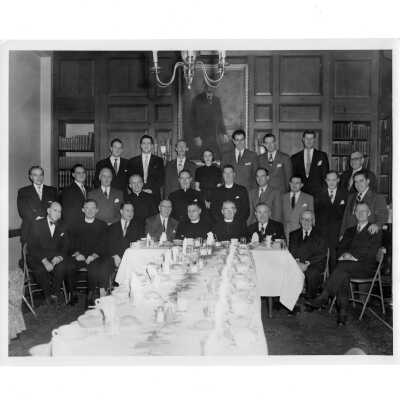 New York area alumni reunion, November 30, 1951, including Edward G. Jacklin, S.J., Joseph S. Hogan, S.J., Robert Cranage, Leo Tully, Frank Folson, and John S. O'Conor, S.J., Madeleine Redditt (class 1950), Francis Daily, and Paul Daly.