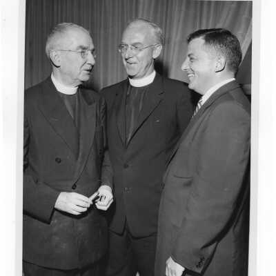 Joseph S. Hogan, S.J., J. Joseph Bluett, S.J., and Carmen Casciato at testimonial dinner for Father Hogan, May 26,1957.