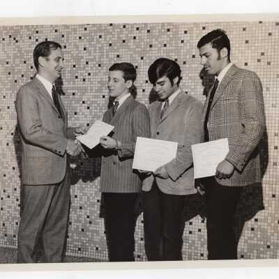Three high school students receiving certificates of merit for participating in Chemistry Department's Science Motivation Program, spring 1968.