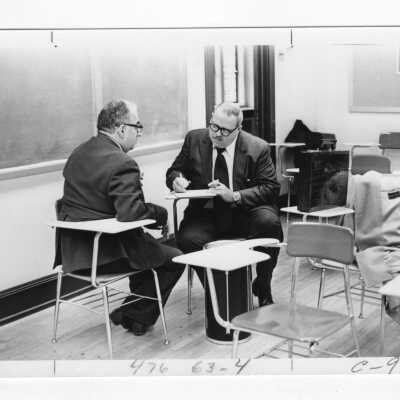 Thomas E. Leaver: Faculty, Accounting; member of SJC's Council on Business Ethics. Also in photo is Joseph J. George, Faculty, English.