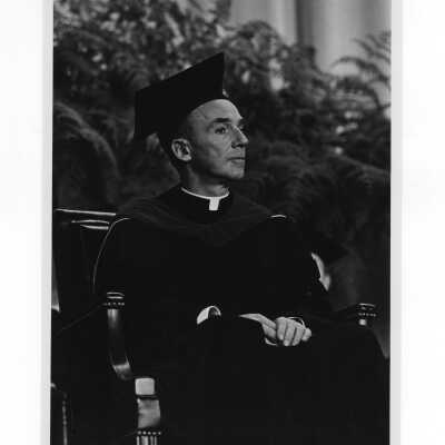 Inauguration of President Terrence Toland, S.J., November 14, 1968. Close-up of Father Toland on stage during ceremony.