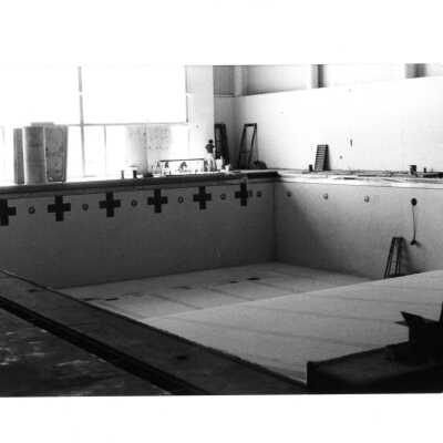 Interior view of swimming pool under construction in Sports Complex.