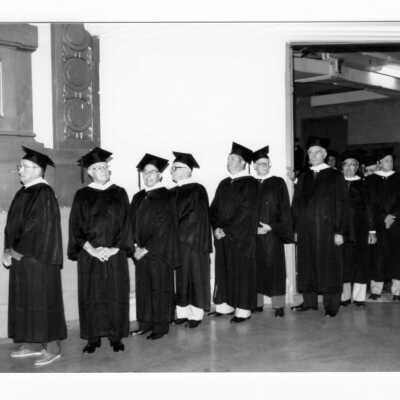 Procession of alumni, possibly Golden Hawks during 1990 graduation/commencement in Philadelphia Civic Center.