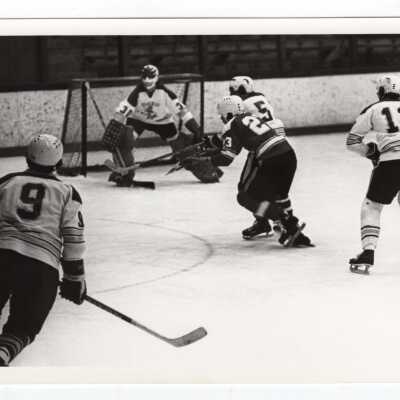 Men's ice hockey team in game.