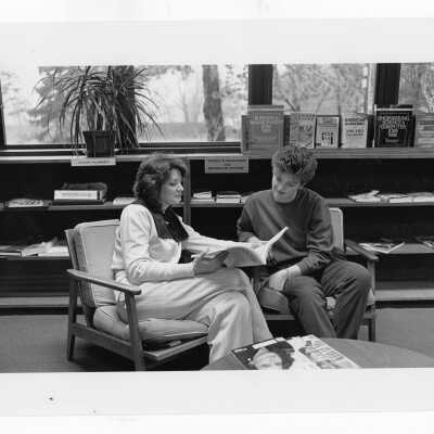 Two women talking in career planning office.