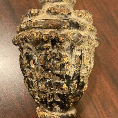 Staircase Railing Detail: This artifact was found during during renovations. It was encased in cement below the lobby front office.