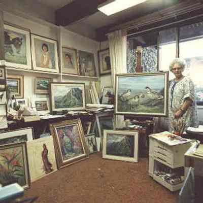 Birley (artist) in her studio in Honolulu with some of her portraits, c. 1982. Photographer unknown: From www.birley.org/FamilyPhotos