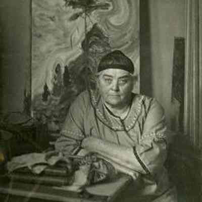 Artist Emily Carr in her studio in front of "Sunshine and Tumult", c. 1939. Photograph by Harold Mortimer-Lamb (1872-1970): From Royal B.C. Museum and Archives (Acc. 193501-001)