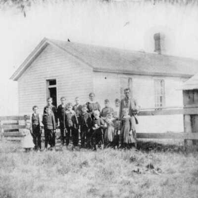 Skinner School with class and teacher, 1885