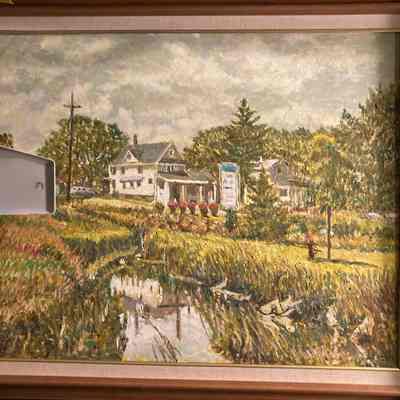 Outdoor summer scene with white houses and river and trees