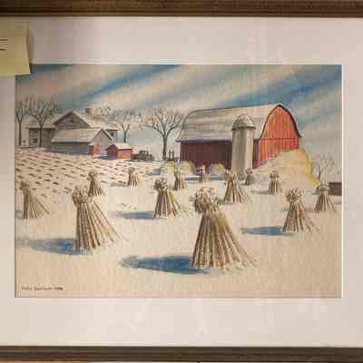 Haystacks on farm and Red Barn