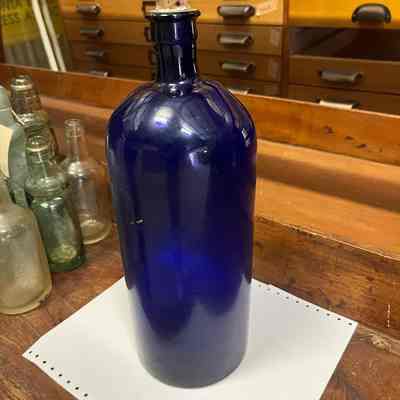 Large blue glass bottle