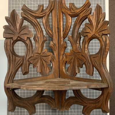 Carved wooden corner shelf