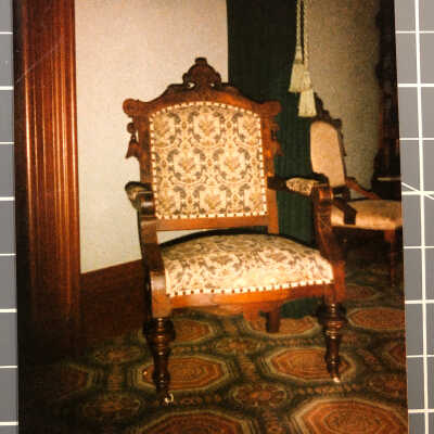 Photo showing chair with original fabric as arrived at CSH. 