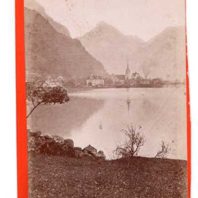 Flüelen: Appears to be an image of Fluelen, Switzerland. A primarily German speaking municipality of central Switzerland. It appears the photograph is credited to the workshop/store of Richard Sohn of Zurichsee (Lake Zurich), Mannedorf. 